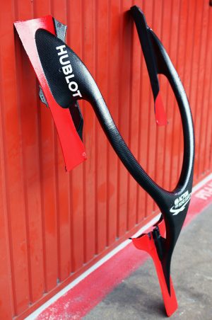 Ferrari SF16-H Halo 2016 Black and red Halo device leaning up against a red garage wall